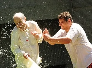 The Splash Brothers: Bruce Hammock (left), UC Davis distinguished professor and researcher Christophe Morisseau engage in a water battle. (Photo by Kathy Keatley Garvey)Just call it