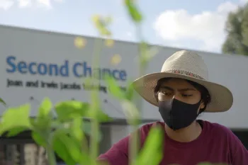 Youth tends the garden at Second Chance