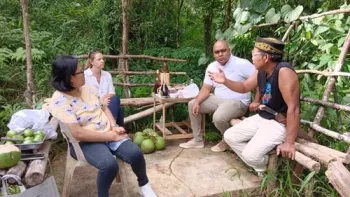 Rachael Callahan (UC SAREP), Michael Pascual (Grameen Foundation), and ASHI staff member meeting with local farmer in Laguna province