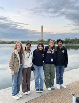 Five youth posing in front of Washington Monument