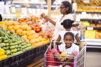 Family shopping for food at an organic marketplace