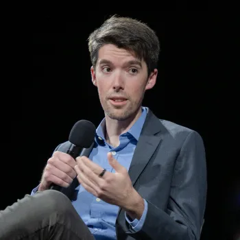 Swain speaking at a conference