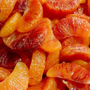 Red and orange peeled mandarin slices. 
