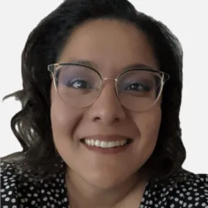 a headshot of a woman with dark brown hair and glasses