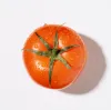 Red tomato on white background